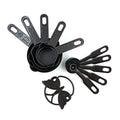 Set of black plastic measuring cups and spoons, featuring a butterfly-shaped holder for organization